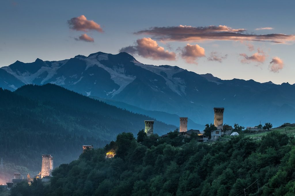 Evening view of Mestia's historic defensive towers, heart of the Svaneti region's celebrations.