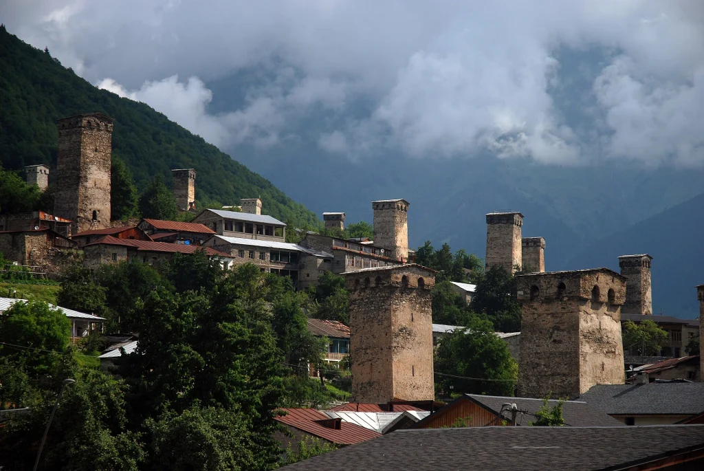 Medieval Svan defensive towers rise above the rooftops of Mestia village.