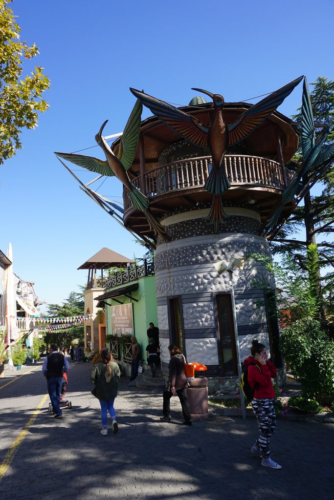 Visitors stroll through Mtatsminda Park, the hilltop venue hosting Tbilisi's annual Honey Festival.