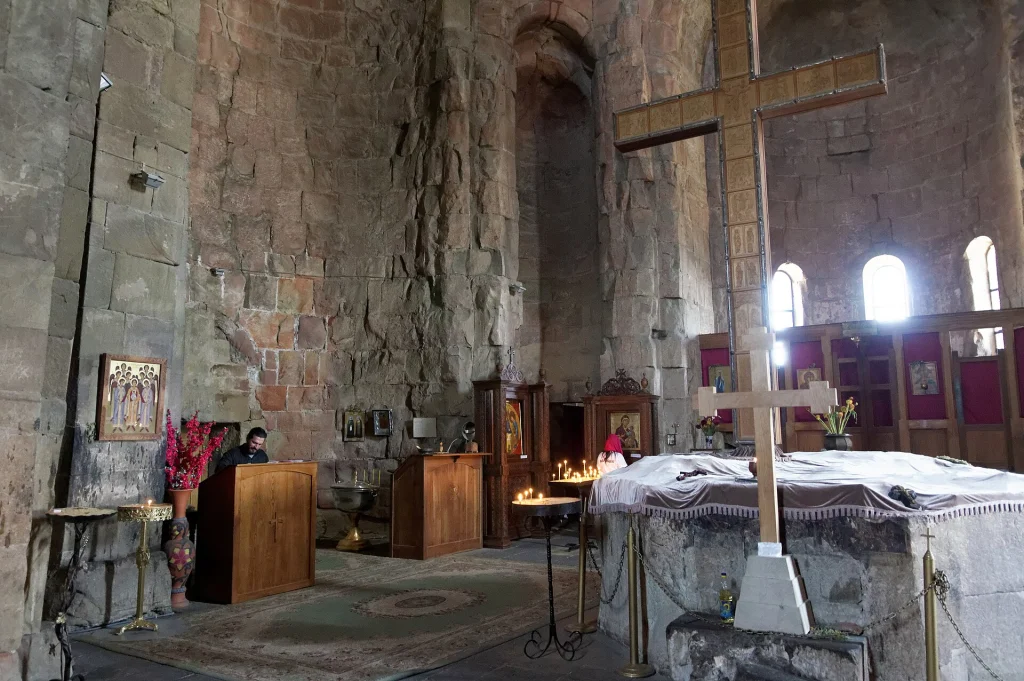 Interior of Jvari Monastery showing the ancient wooden cross and altar venerated by pilgrims.