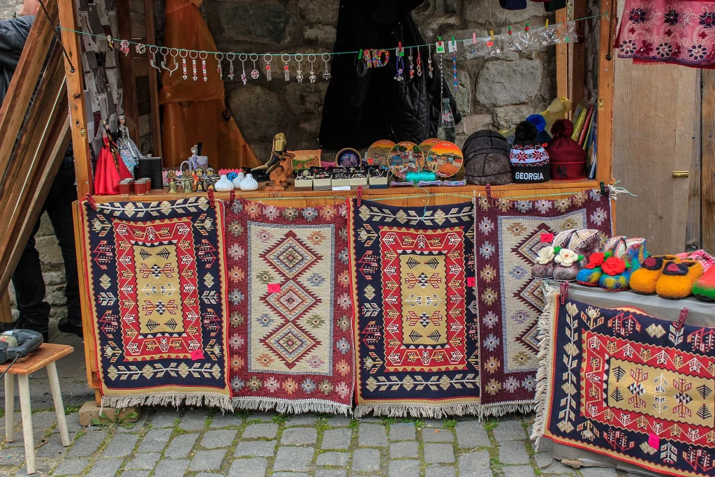 A market stall selling traditional carpets and souvenirs in Mtskheta, Georgia.