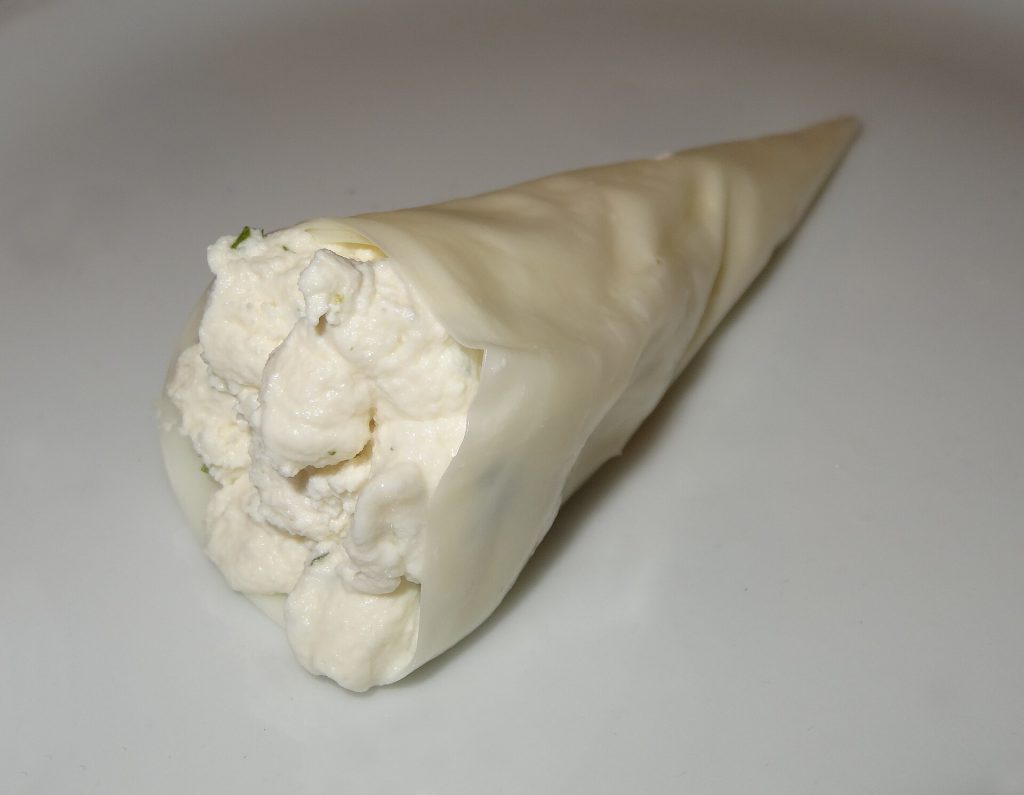 Nadugi curd wrapped in sulguni, a classic Georgian cheese delicacy featured at the festival.