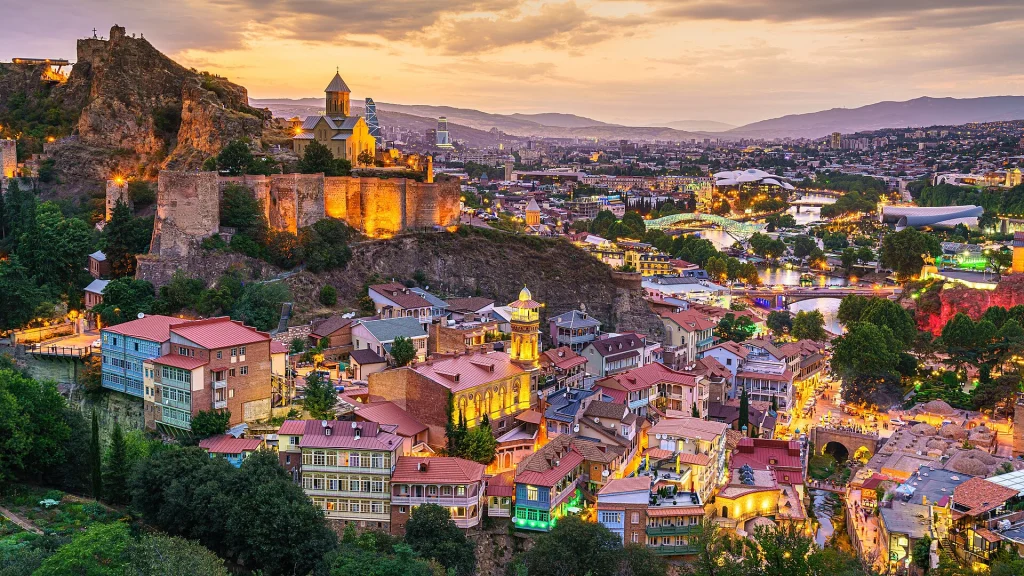 Evening view of Tbilisi's Old Town and Abanotubani, a key sightseeing area for travellers.