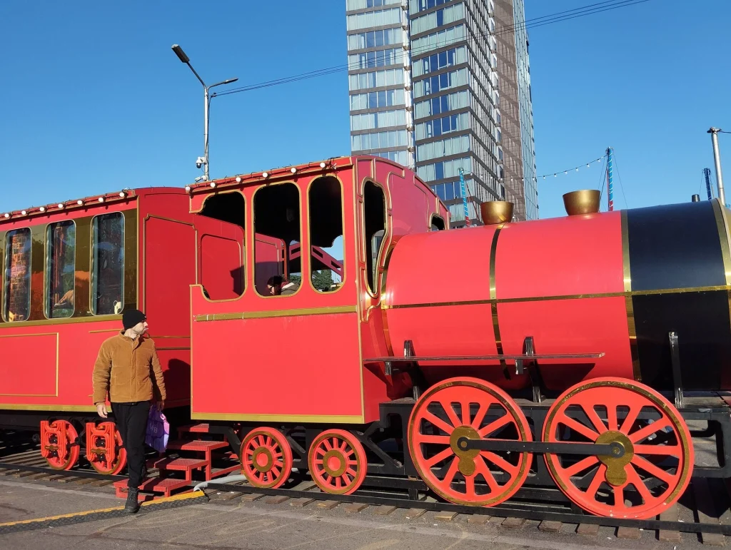 A red New Year's train attraction stands in central Tbilisi for the 2026 holidays.