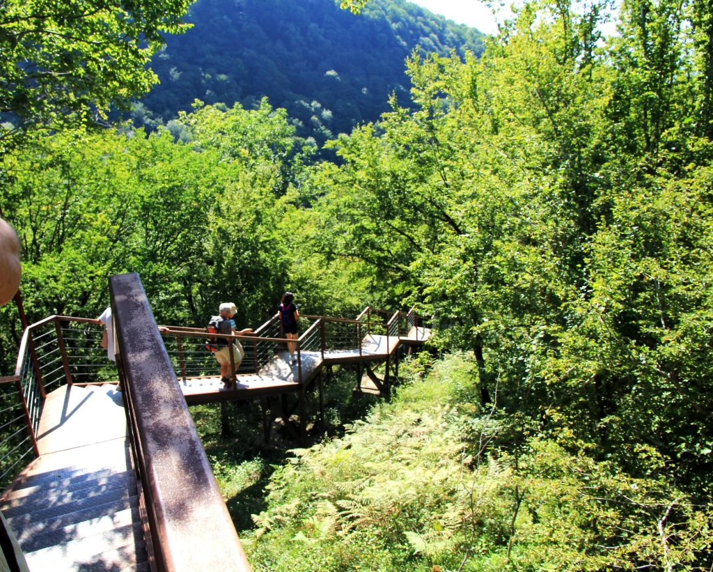 Visitors walk the suspended walkway through Okatse Canyon in western Georgia.