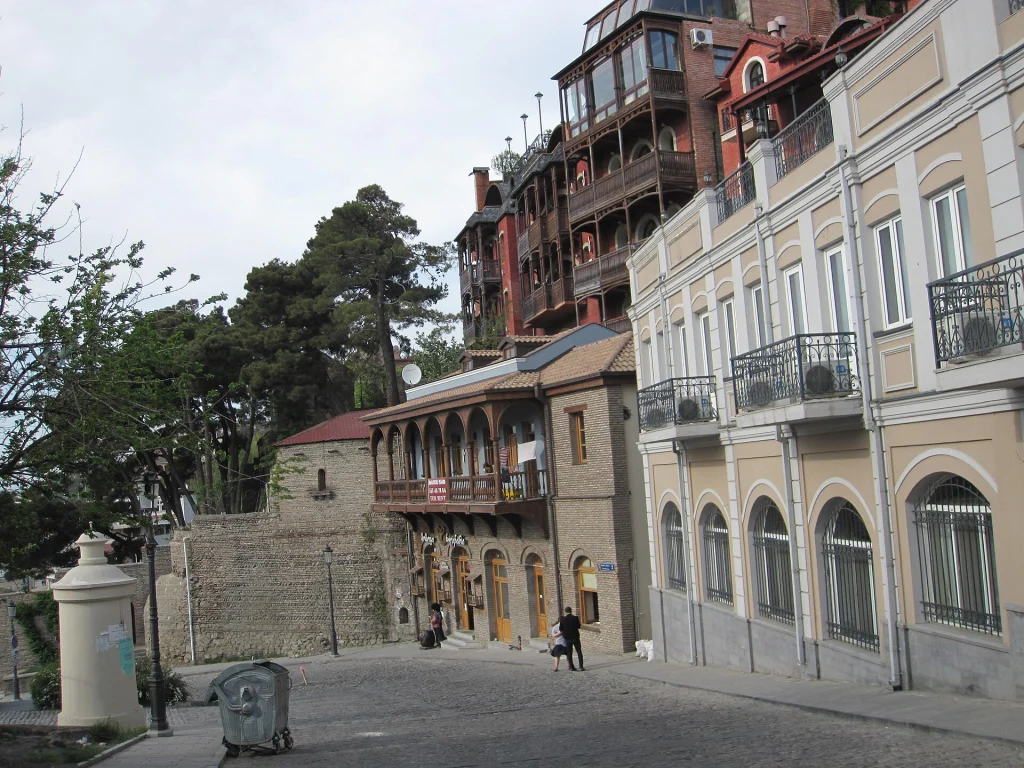 A spring afternoon along a cobblestone street in Tbilisi's historic district.