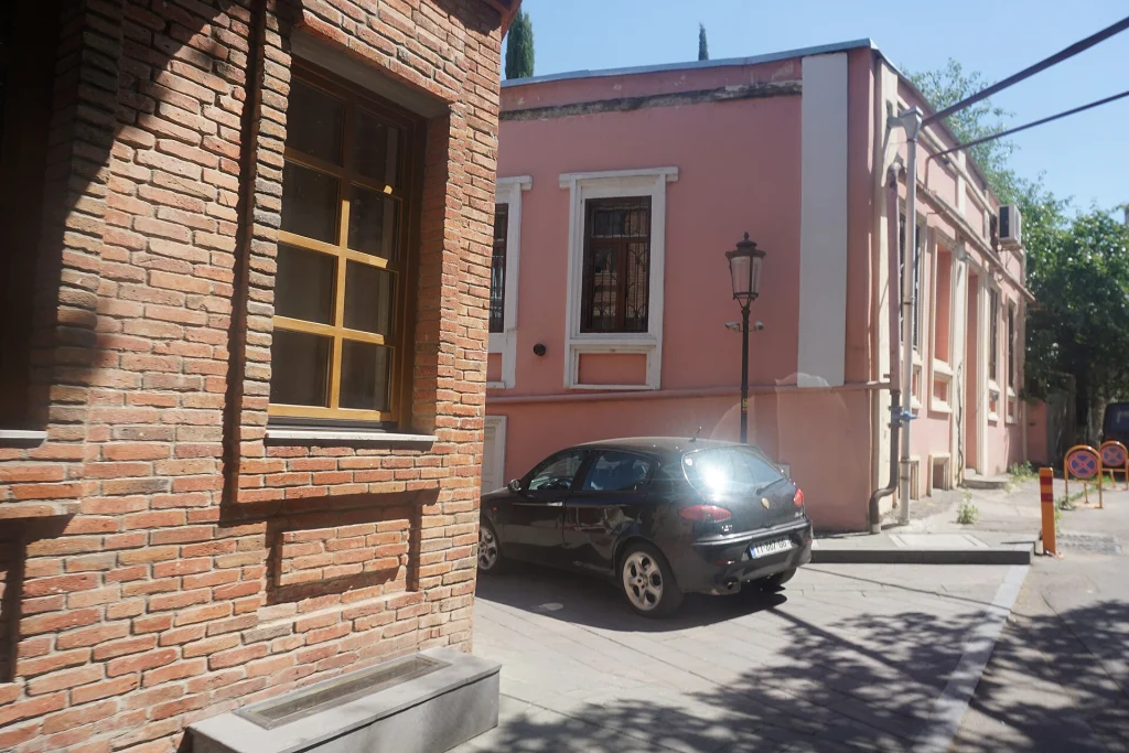 A quiet Old Tbilisi street with period architecture typical of the capital.