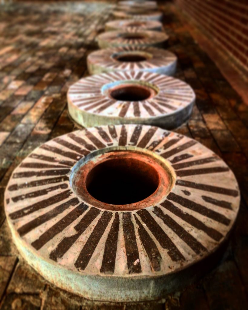 Traditional qvevri clay vessels used for fermenting and aging Georgian wine.