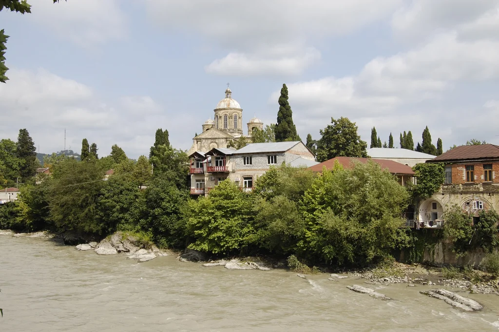 View of Kutaisi along the Rioni River, showing the townscape near budget accommodation areas.