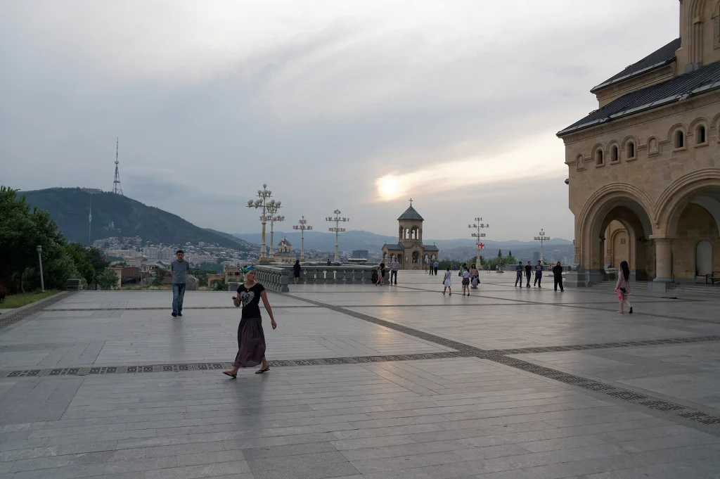 Holy Trinity Cathedral (Sameba) courtyard, Tbilisi's most iconic landmark at dusk.