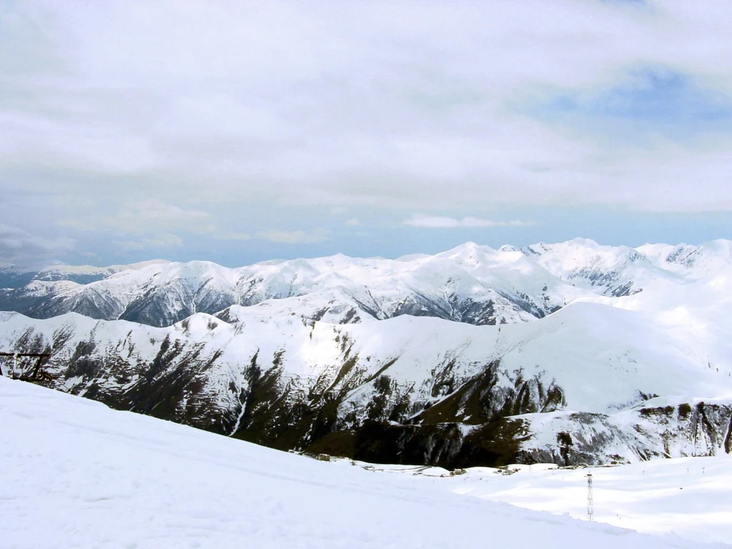 Snow-covered Caucasus peaks above Gudauri, a well-known mountain destination in Georgia.
