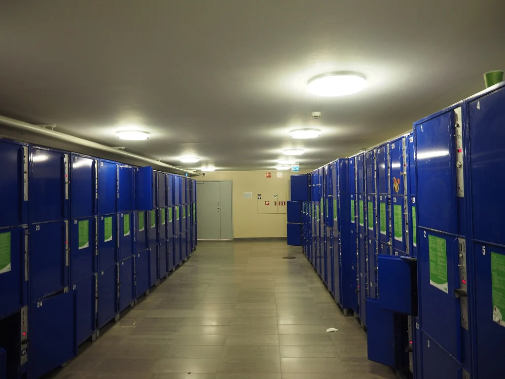 Rows of coin-operated storage lockers at a railway station, similar to those found at Tbilisi's train stations.