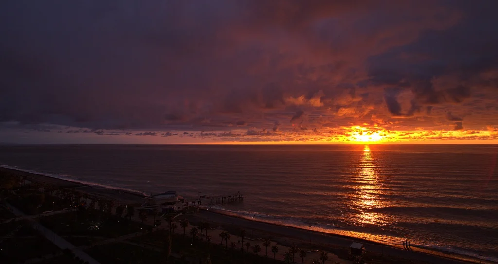 Dramatic sunset sky over the Black Sea coastline at Batumi, Georgia.