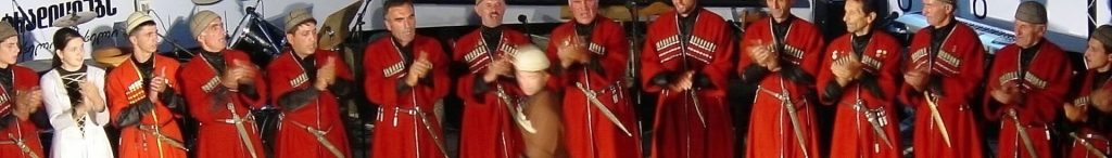 Close view of Svanetian dancers in costume, representing the folk celebrations of Lashkhetoba.