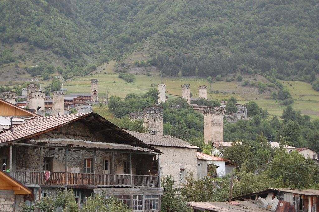 Mestia's iconic stone towers rise above the Svaneti village where the festival takes place.