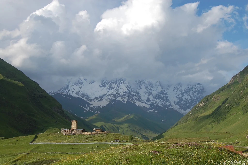Snow-capped Caucasus peaks rise above the valley near Ushguli in Svaneti.