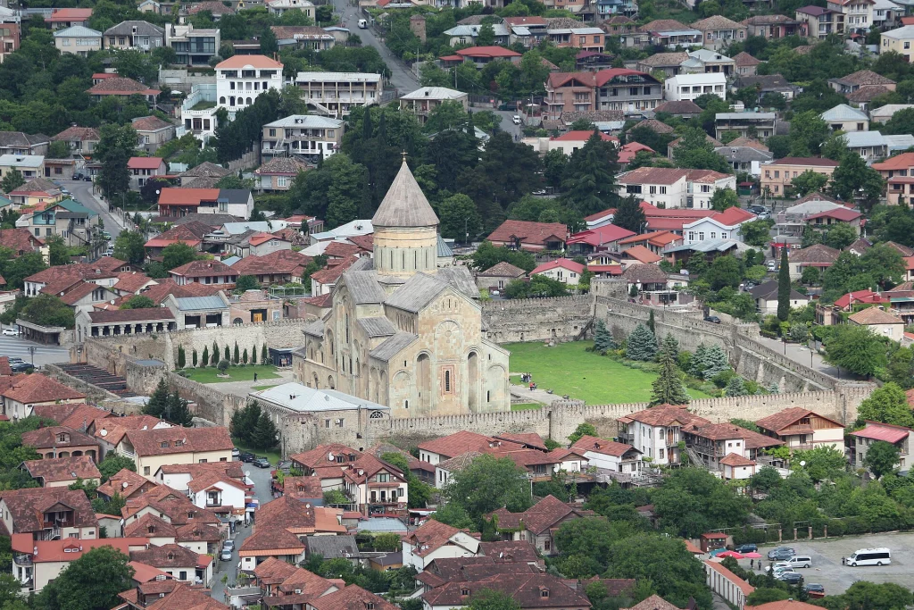 Aerial view of Mtskheta town with Svetitskhoveli Cathedral, a landmark for travellers to Georgia.