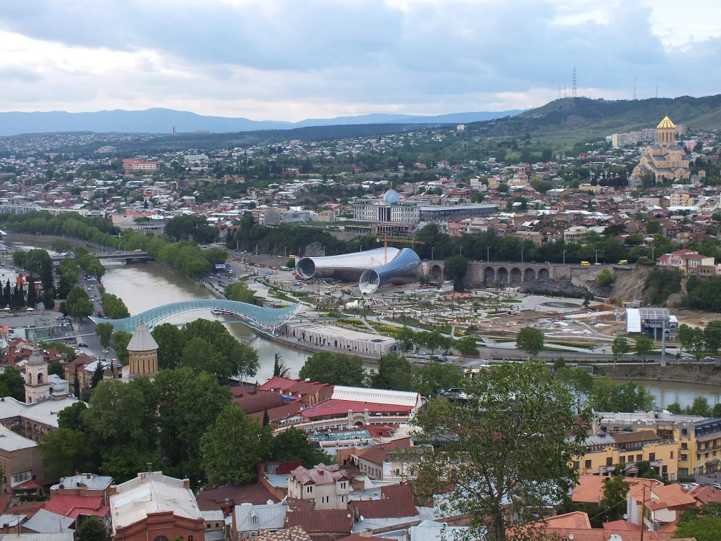 Panoramic view of Tbilisi's Old Town and Rike Park along the river.