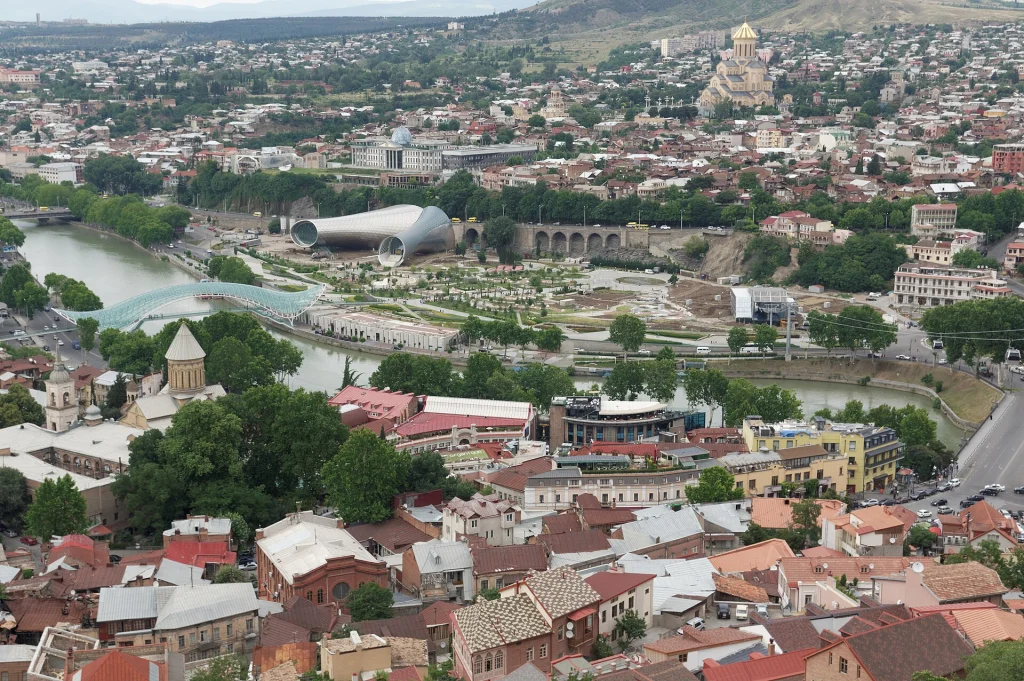 Aerial view of Tbilisi, Georgia, showing the city where dining and tipping customs are described.
