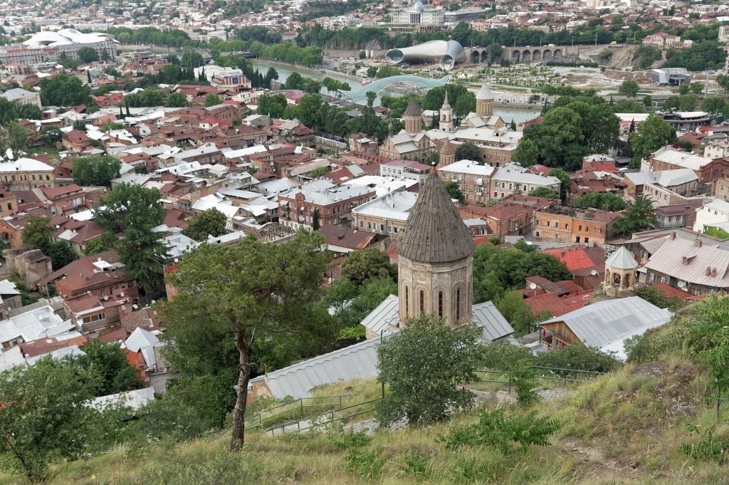 Old Tbilisi skyline viewed from Narikala hill, representing the capital's varied climate.