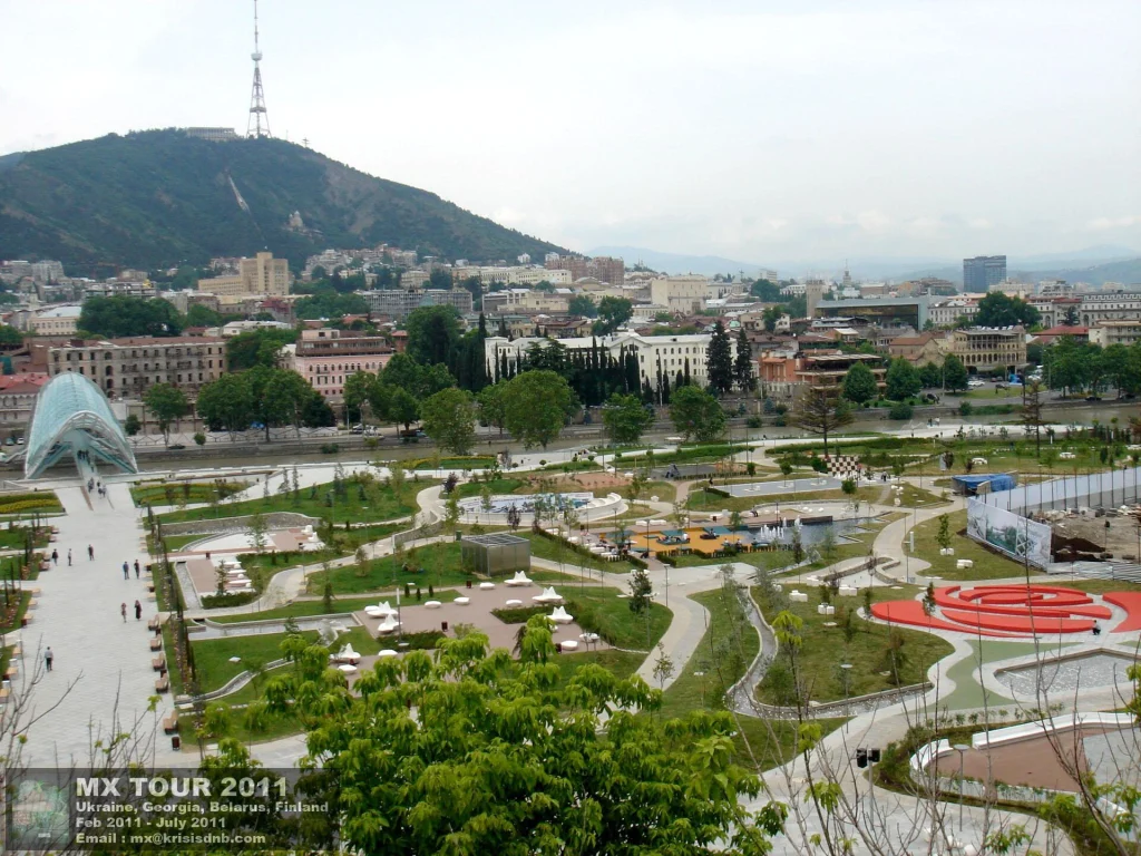 Tbilisi's modern Rike Park with the old city skyline behind, a popular public space.