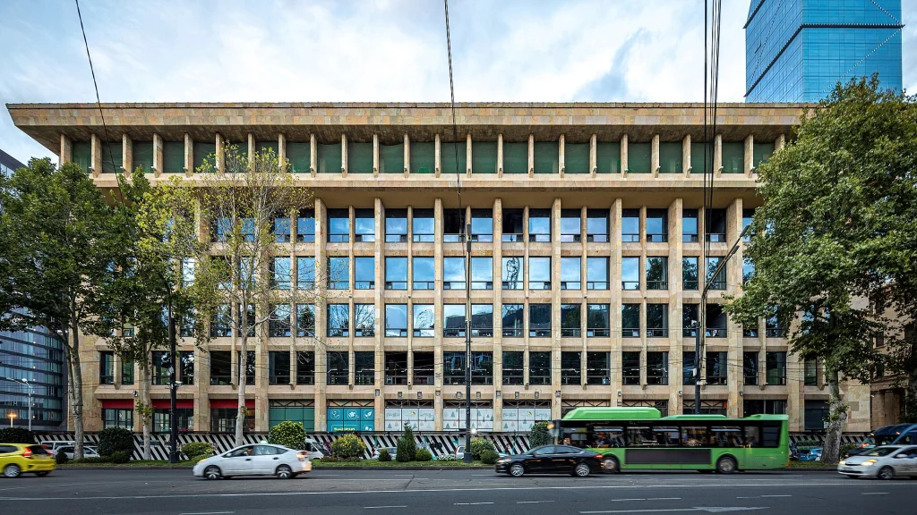 A Soviet-era brutalist building on Rustaveli Avenue typifies the architectural style of the new hotel.