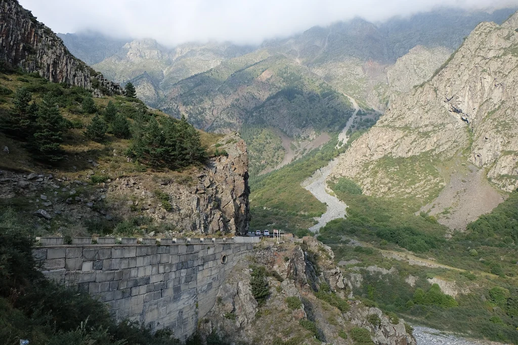 Georgian Military Highway winding through dramatic mountain terrain near the Russian border.