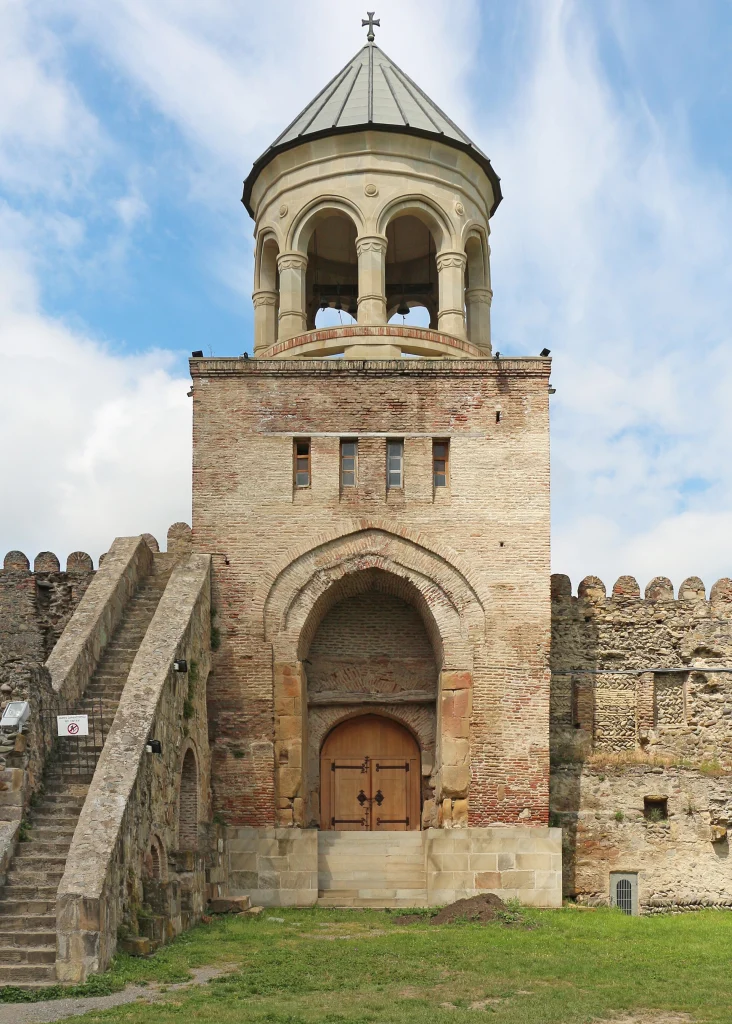 Stone bell tower at the western entrance of Svetitskhoveli Cathedral in Mtskheta.