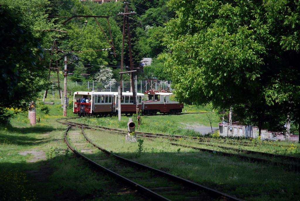 Two Kukushka trains pass each other at Tsagveri station on the Borjomi–Bakuriani line.
