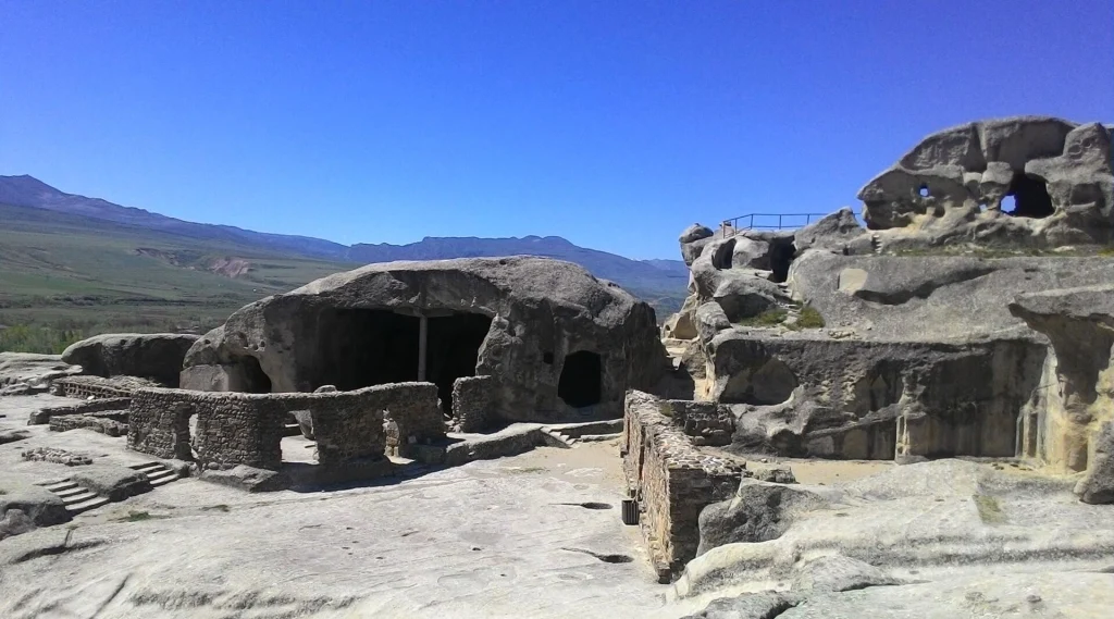 General view of Uplistsikhe's ancient rock-hewn town with its restored basilica church.