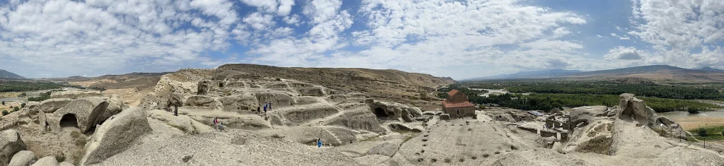Panoramic view of the cave town's carved chambers stretching along the rocky plateau.