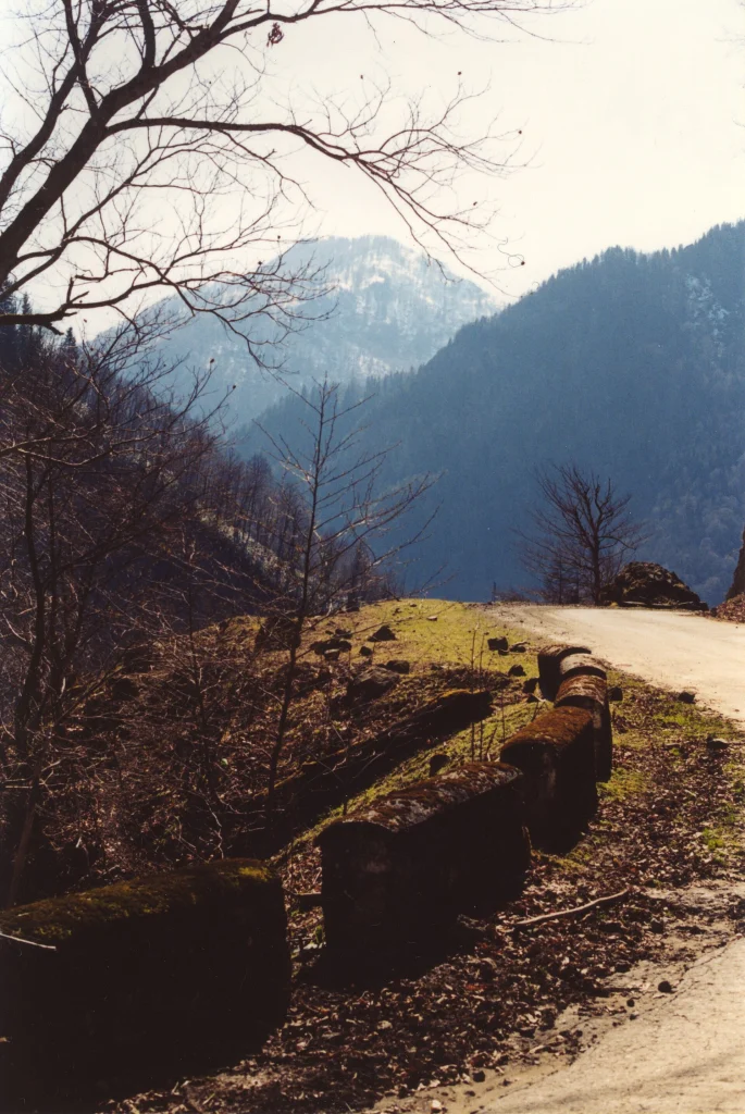 A van with a blown tire on the Upper Svaneti road shows the real risks of travelling this route.