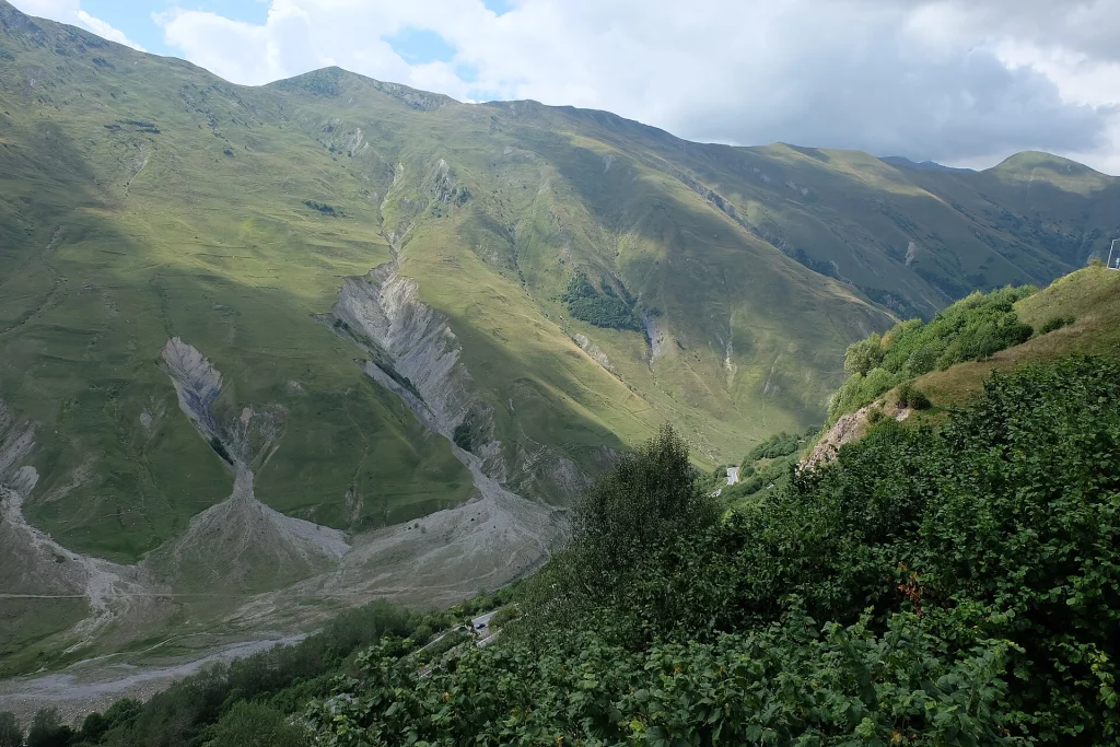 Scenic green mountain valley of the Georgian Military Highway en route to Kazbegi.