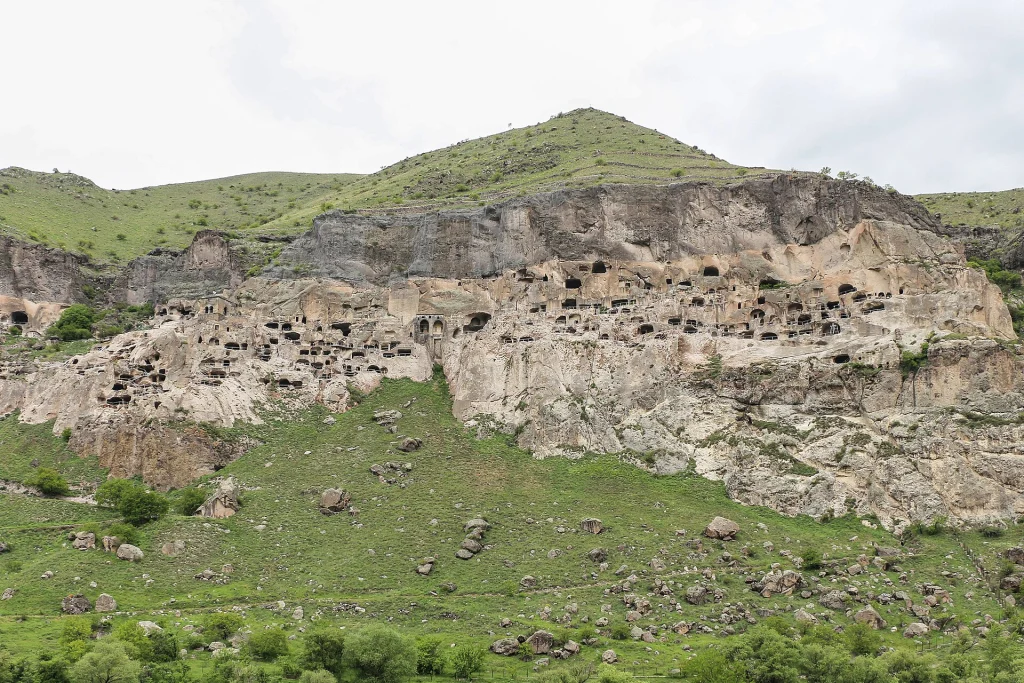 Rows of cave dwellings and churches honeycomb the cliff face at Vardzia.