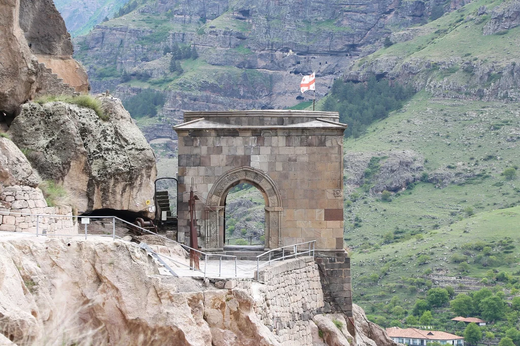 The stone entrance arch leading into the ancient cave monastery of Vardzia.