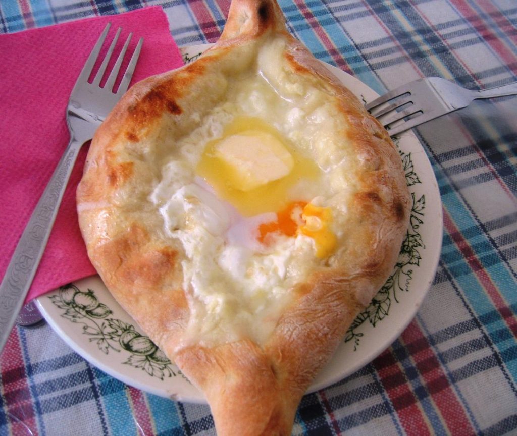 Adjaruli khachapuri, the cheese-and-egg bread traditionally served at Didacharoba feasts.