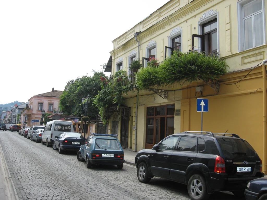 A cobblestone street lined with old buildings in Batumi, Georgia.