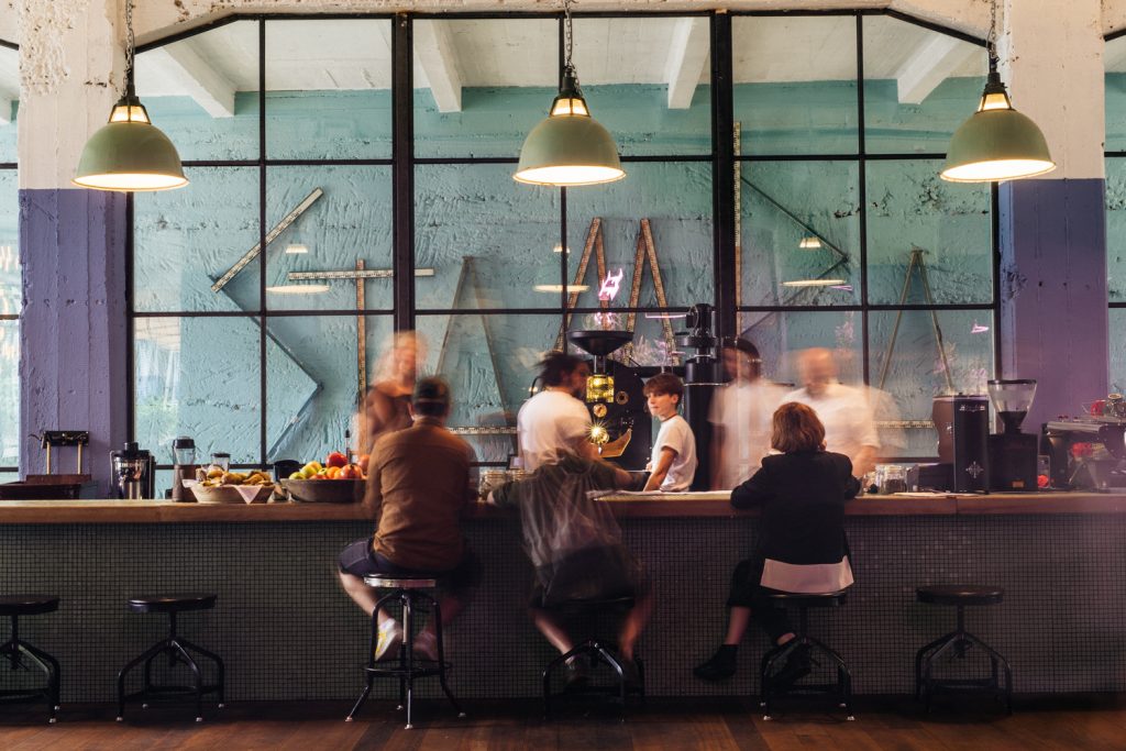 Visitors gather at the Stamba Hotel's chocolaterie and roastery, part of the festival's venue complex.