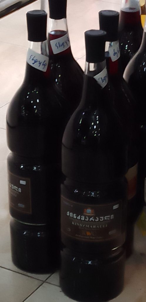 A bottle of Kindzmarauli, a famous Georgian red wine style showcased at wine exhibitions.