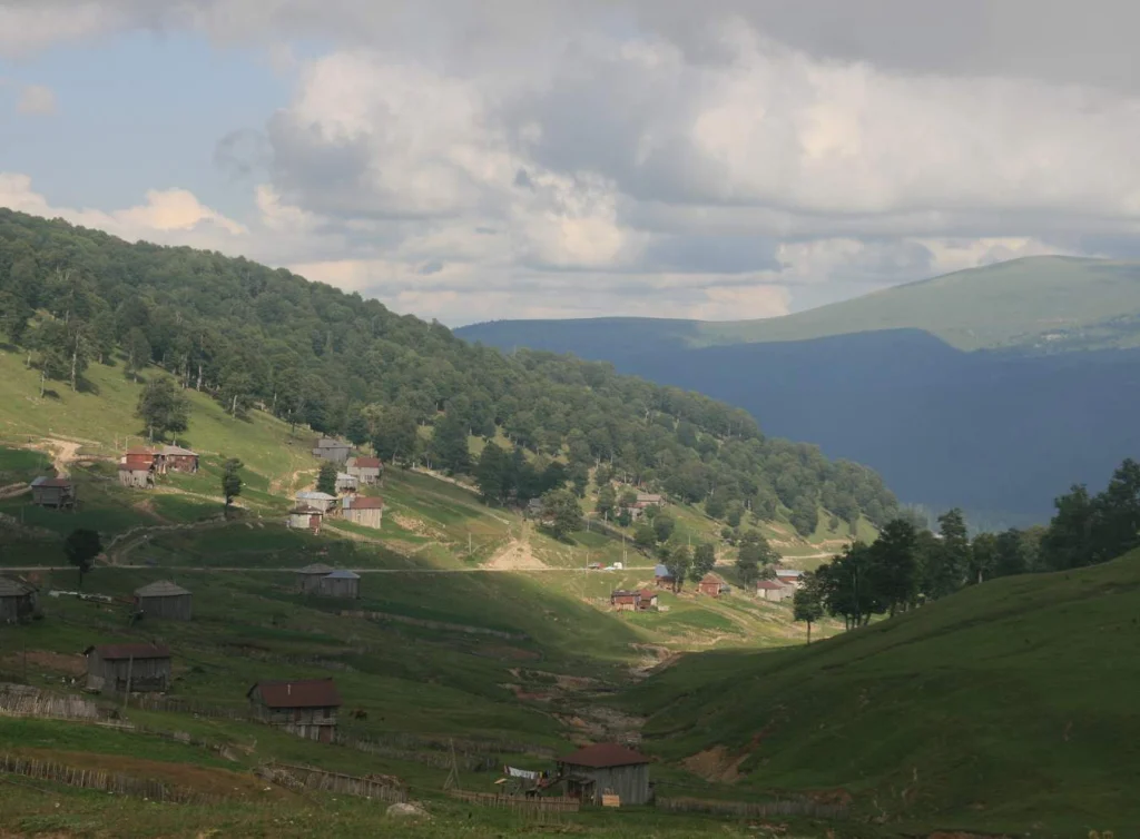 Highland villages and forested slopes line the route near Goderdzi Pass.
