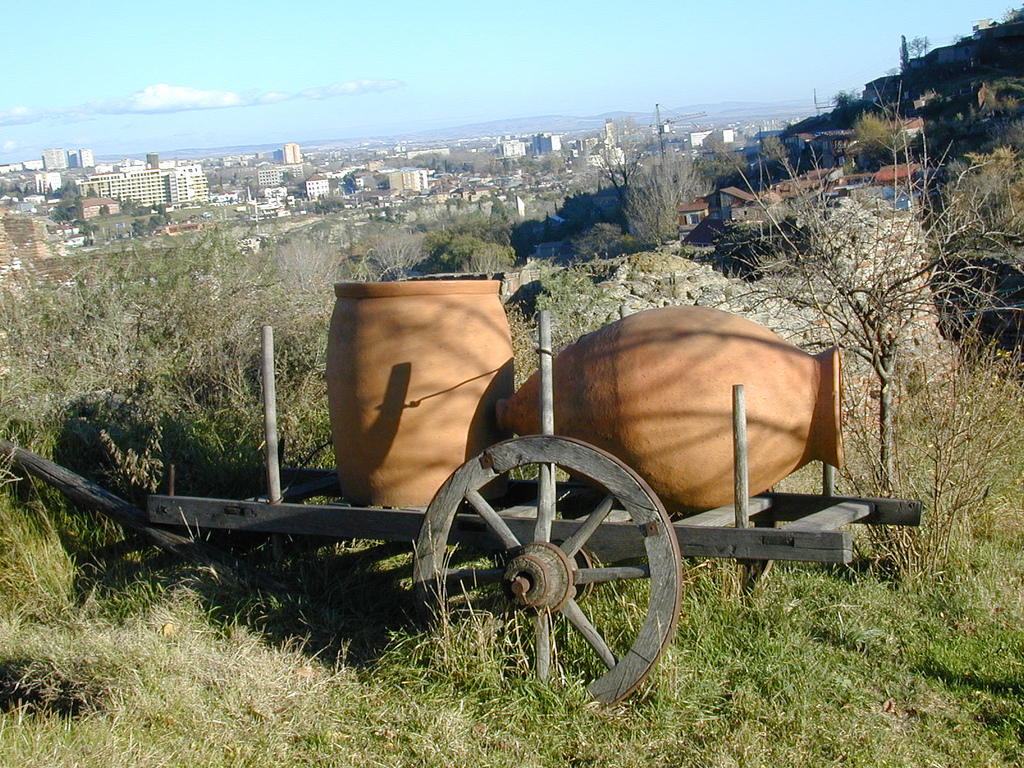 Traditional clay qvevri jars used for fermenting Georgian wine, the fair's signature vessel.
