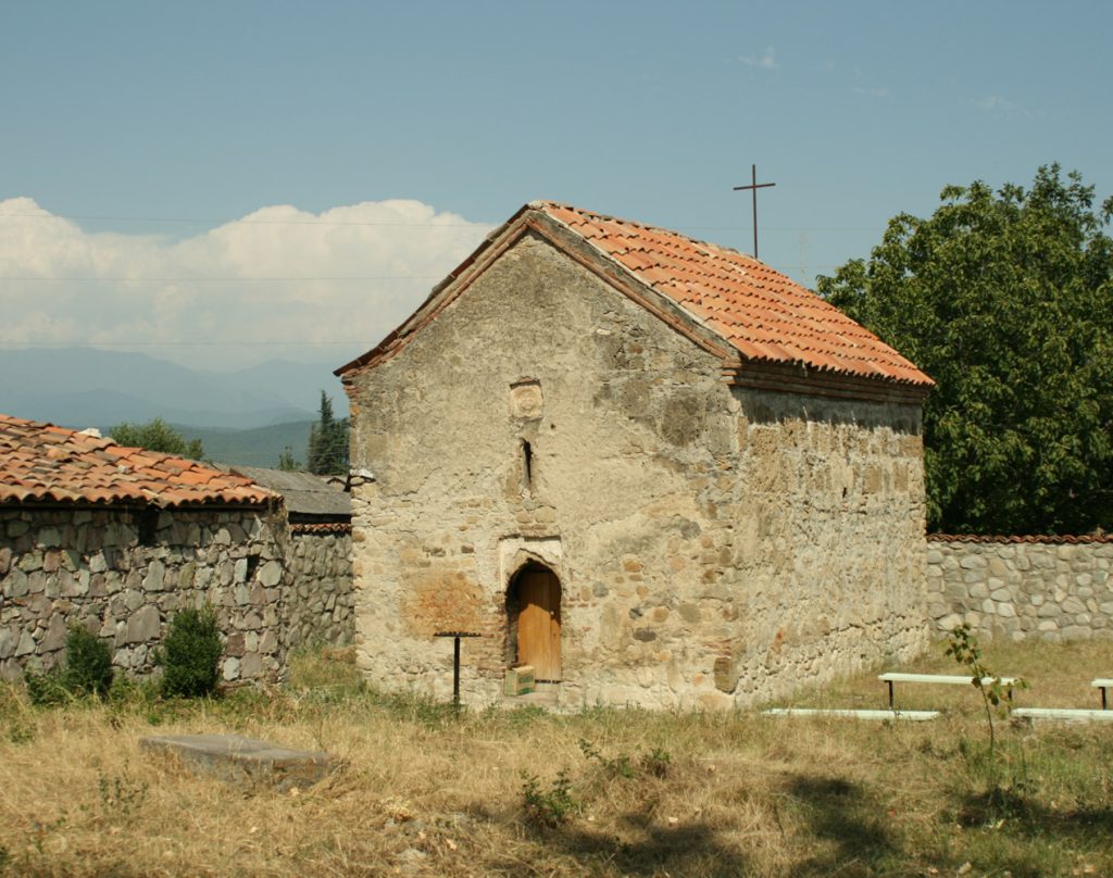 A traditional stone church in Akhmeta, part of the town's sacred and historic setting.