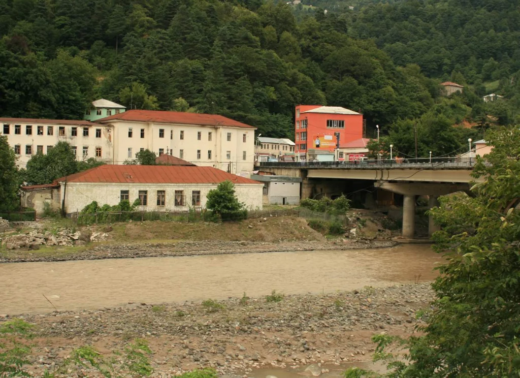 The town of Keda in Adjara nestled among green mountains along a river.