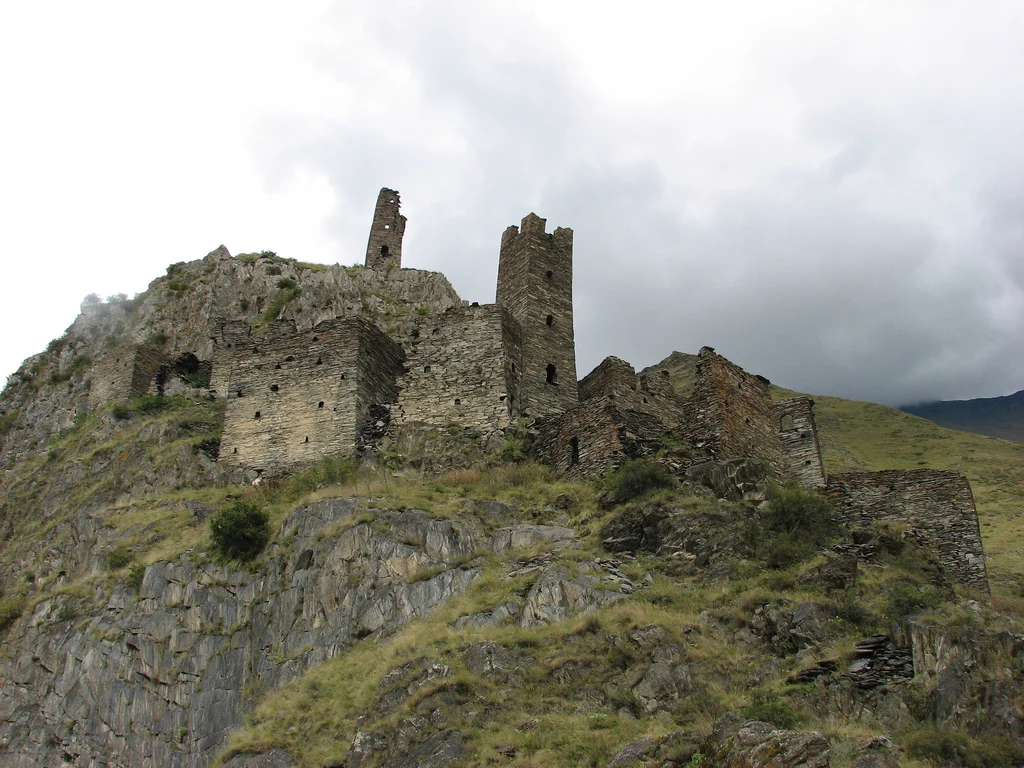 Ancient ruined stone towers of Mutso fortress atop a rocky ridge in Khevsureti.