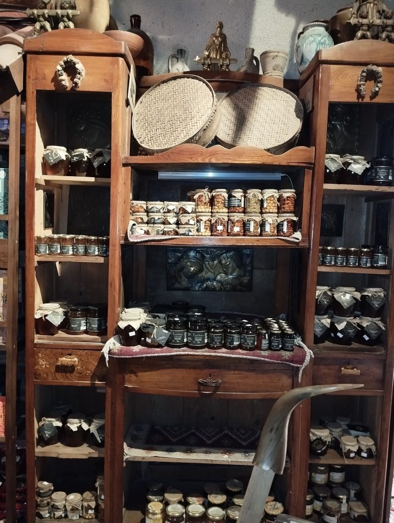 Jars of Georgian honey displayed for sale, the signature product of the Tbilisi Honey Festival.