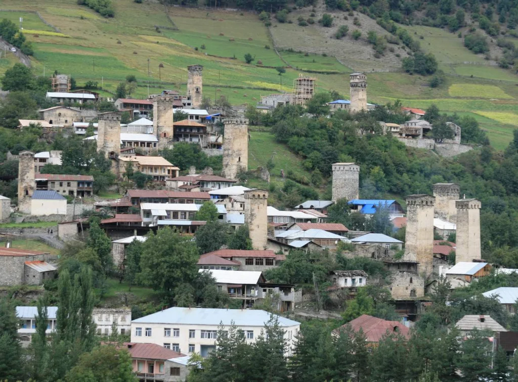 Medieval Svan defensive towers rise above the village of Mestia, a highlight for visitors exploring Georgia.