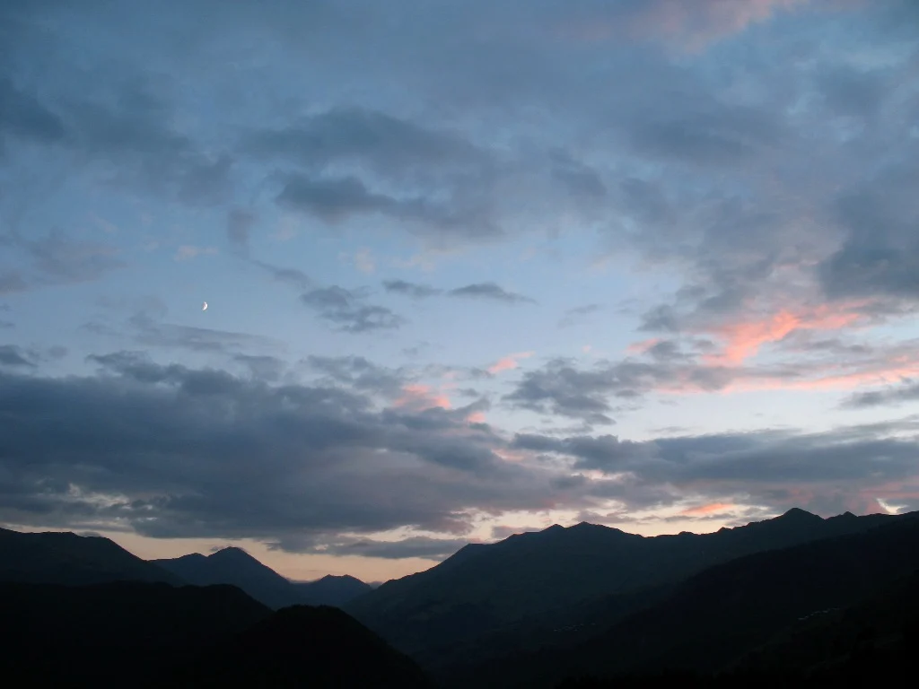 Mountain ridges of Tusheti at dusk, a remote highland region crossed by Transcaucasian Trail cycling routes.