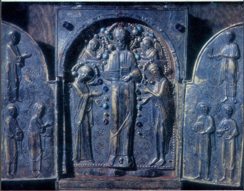 The ornate silver triptych of the Okoni icon, central object of the feast.