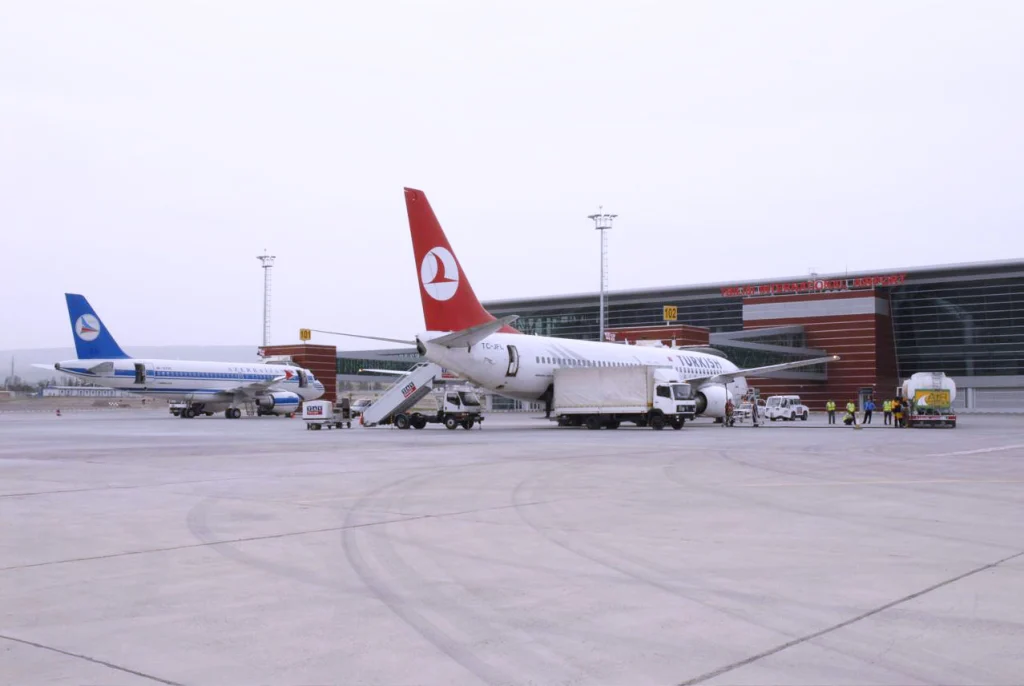 Aircraft on the tarmac at Tbilisi International Airport, where VAT refund desks process traveler claims.