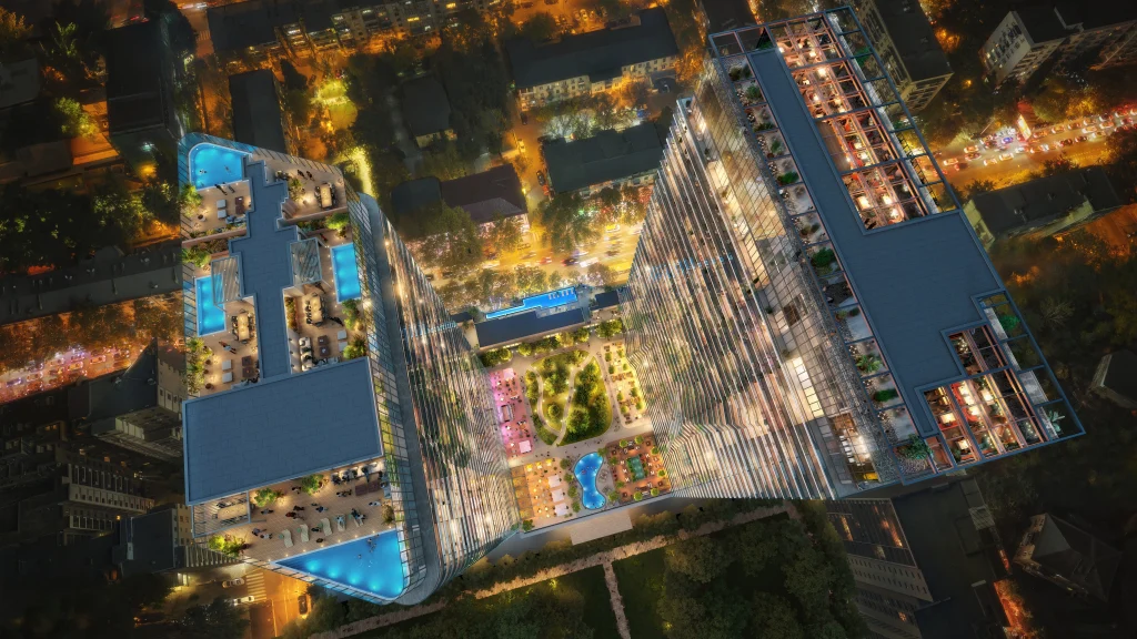 Planet Hollywood Hotel & Casino Tbilisi — Aerial night view of the rooftop pools and landscaped terrace areas.